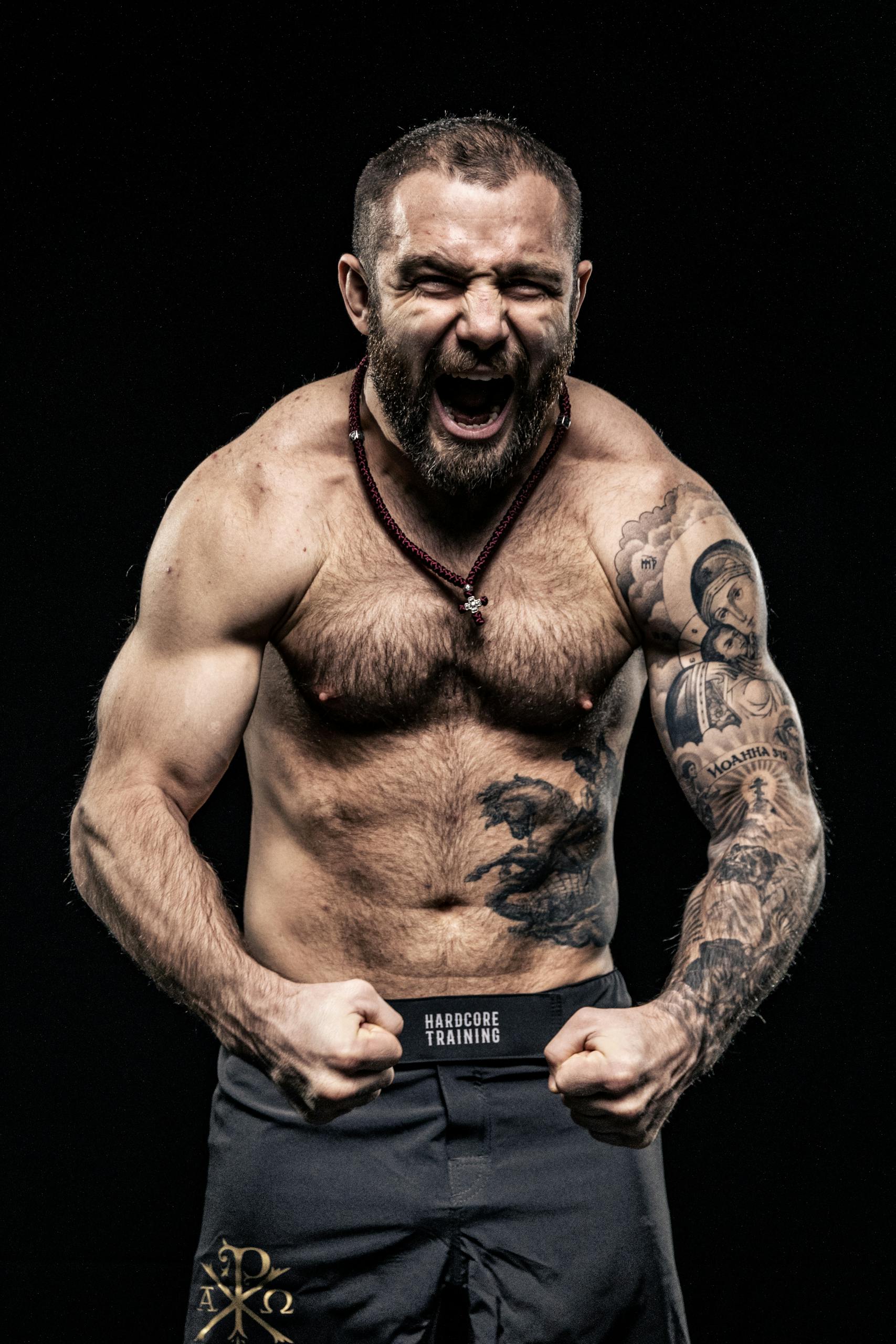 Shouting Shirtless Bodybuilder with Tattoos