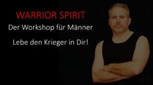 Männlicher Workshop-Teilnehmer mit selbstbewusstem Blick, symbolisiert den Kriegergeist.